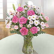 A bouquet of purple roses with white daisies