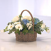 A baby blue basket, white and blue flowers