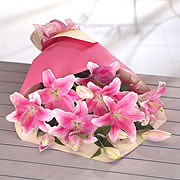 A bouquet of gift wrapped pink lillies